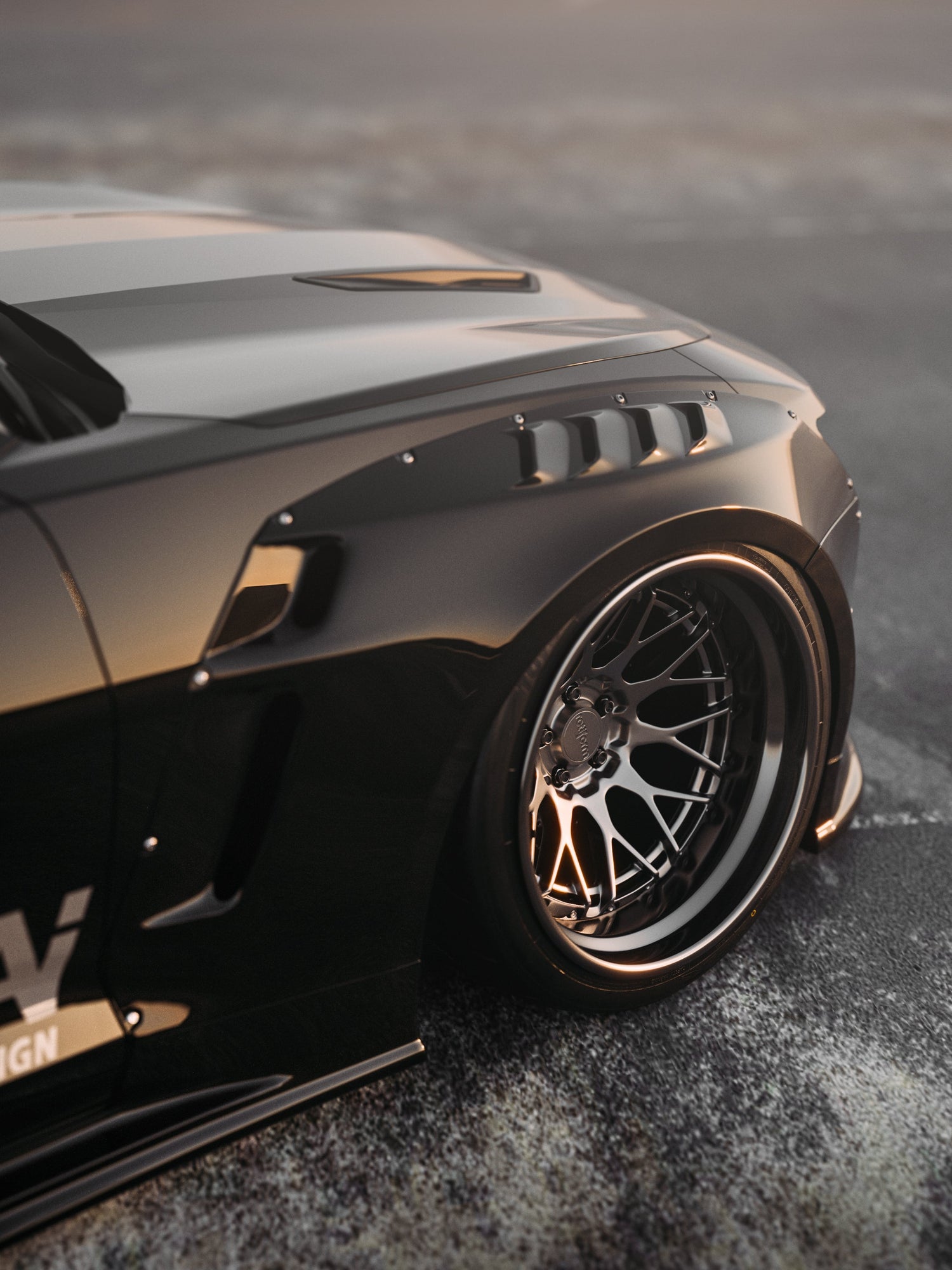 Close-up of Chevrolet Camaro 6th gen widebody kit SHIROKAI Stance lowered Chevy with custom black fender and wheel