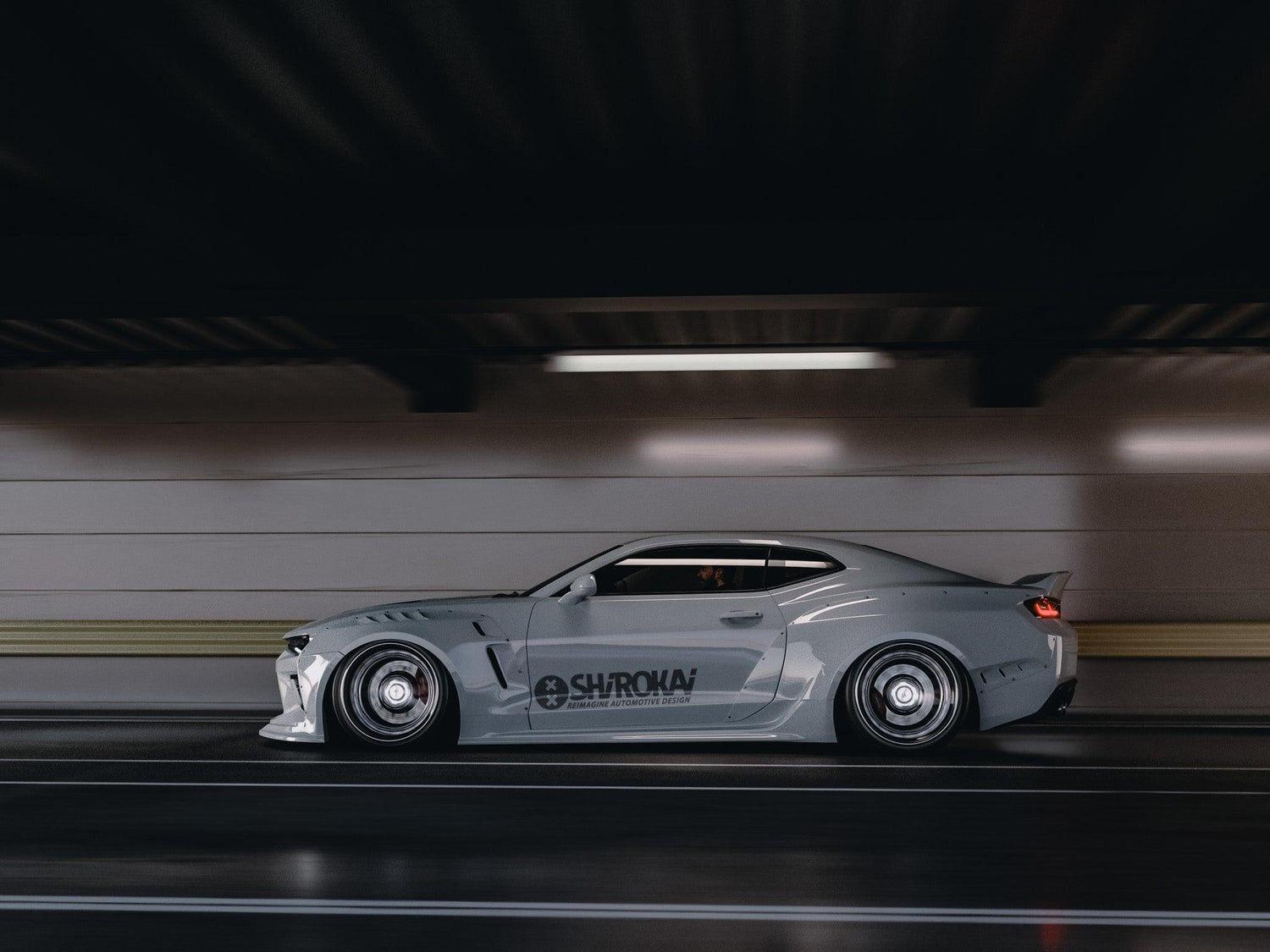 Chevrolet Camaro 6th gen widebody kit SHIROKAI Stance lowered Chevy driving in tunnel with custom widebody design