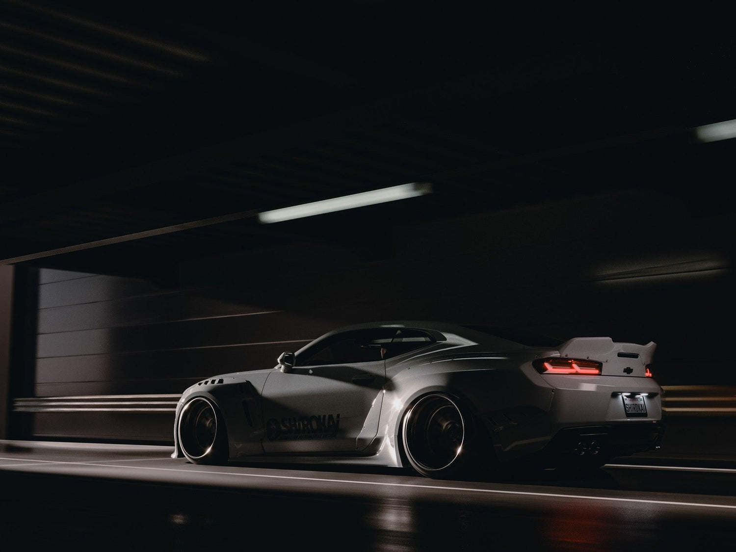 Chevrolet Camaro 6th gen widebody kit SHIROKAI Stance lowered Chevy in dark tunnel with custom aerodynamic body panels