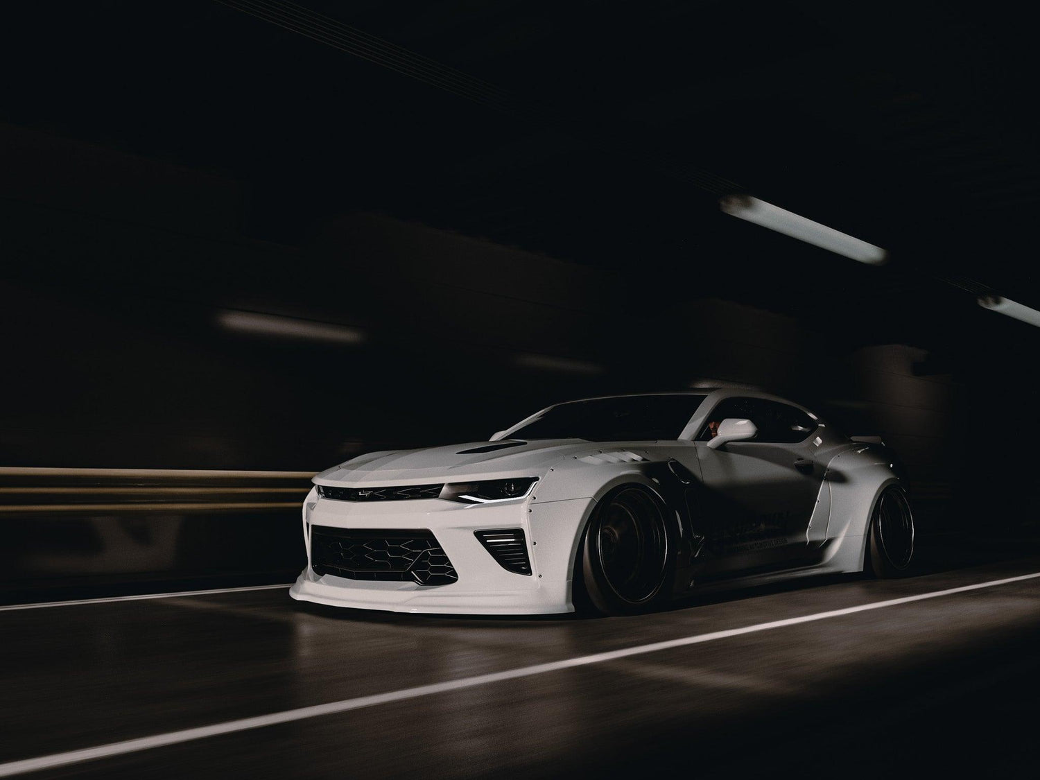 White Chevrolet Camaro 6th gen widebody kit SHIROKAI Stance lowered Chevy in motion on dark road