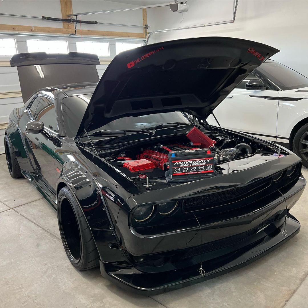 Black Dodge Challenger HELLCAT SHIROKAI widebody kit installed with open hood showing engine details