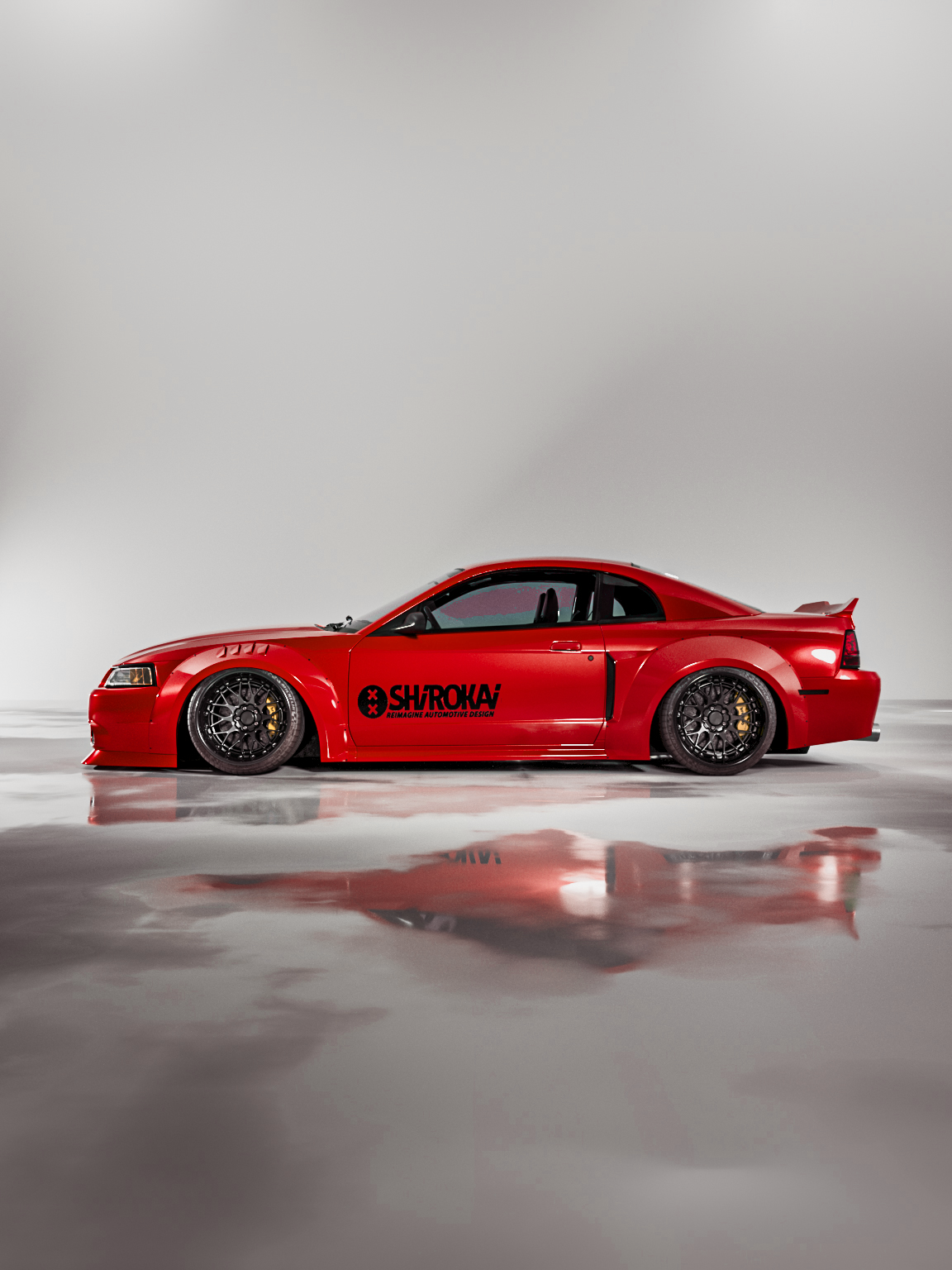 Red 1999-2004 Mustang SN95 Cobra wide-body kit by SHIROKAI with sleek design and black wheels