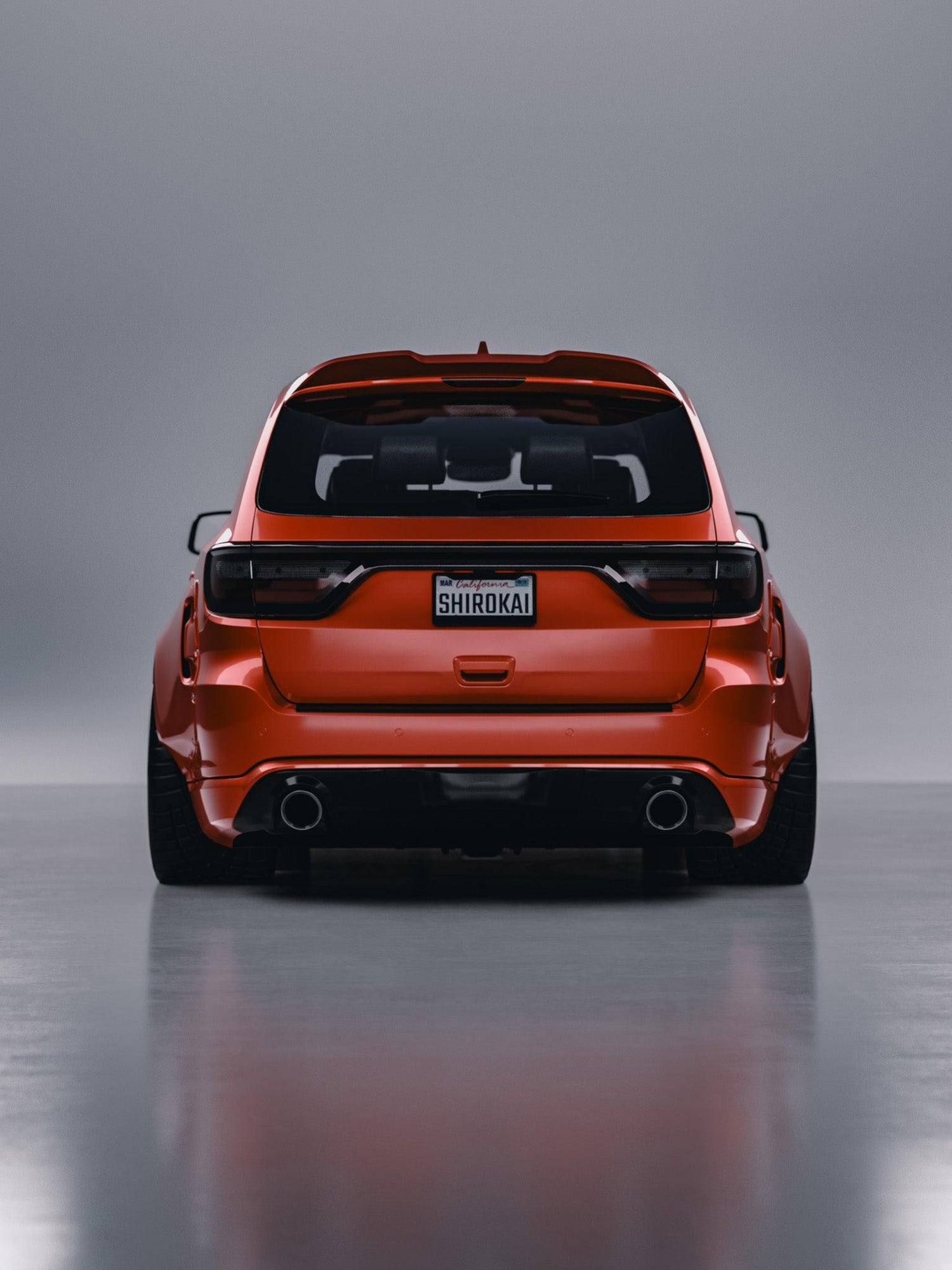 Orange Dodge Durango rear view with SHIROKAI ducktail spoiler installed on roof rear trunk spoiler