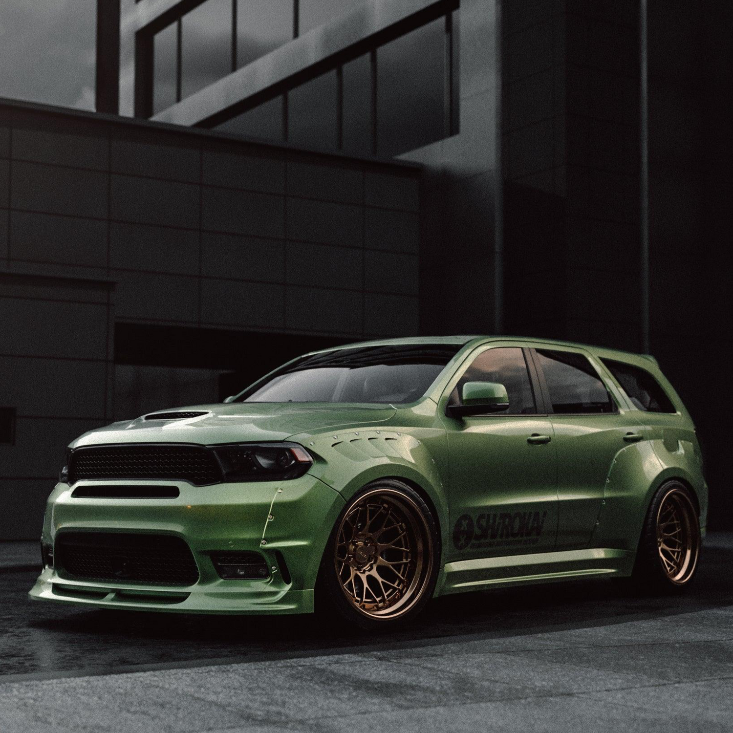 Green Dodge Durango SRT with SHIROKAI widebody kit and bronze alloy wheels parked in urban setting