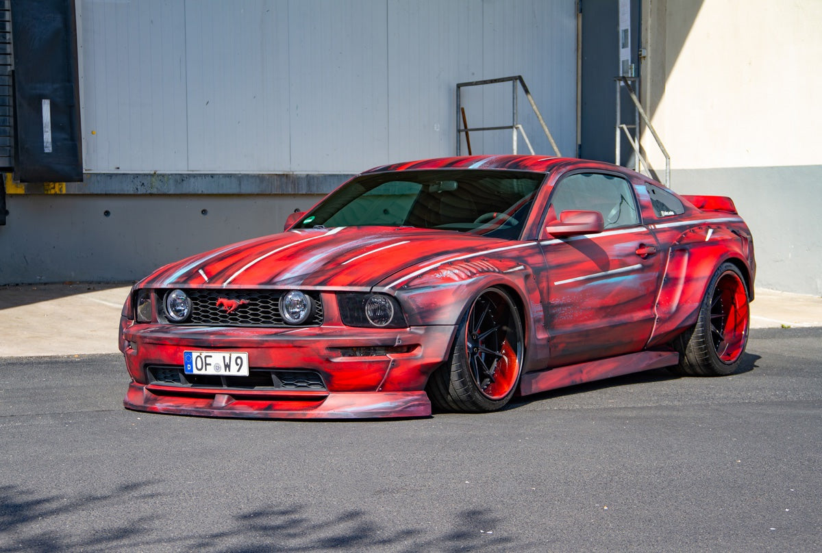 Juliana Schoettner's 2008 Ford Mustang GT S197 with SHIROKAI ABS widebody kit, front three-quarter view