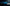 Front view of blue BMW M2 with 2015-2018 widebody kit SHIROKAI installed in dark studio