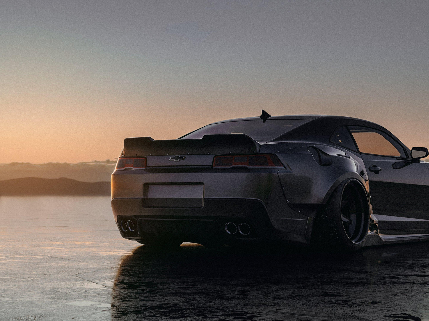 Chevrolet Camaro 5gen SS RS widebody kit SHIROKAI installed on black car at sunset with aggressive rear design