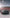 Dodge Challenger HELLCAT SHIROKAI widebody kit on matte black car with red rims and aggressive front splitter