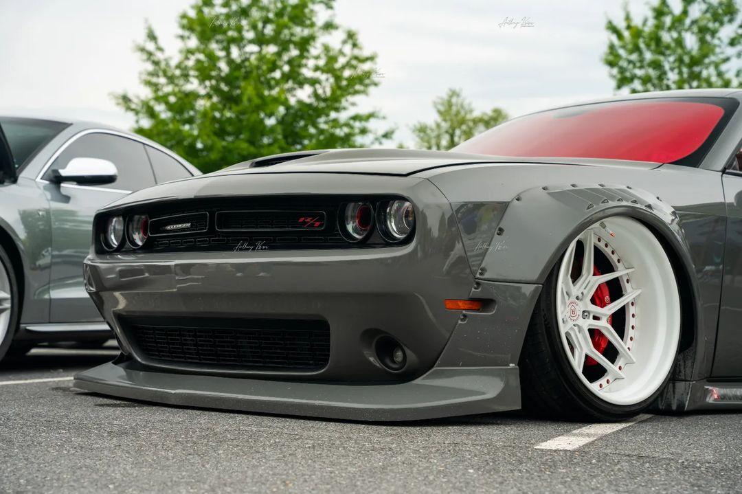 Gray Dodge Challenger HELLCAT SHIROKAI widebody kit with white deep-dish wheels and lowered stance