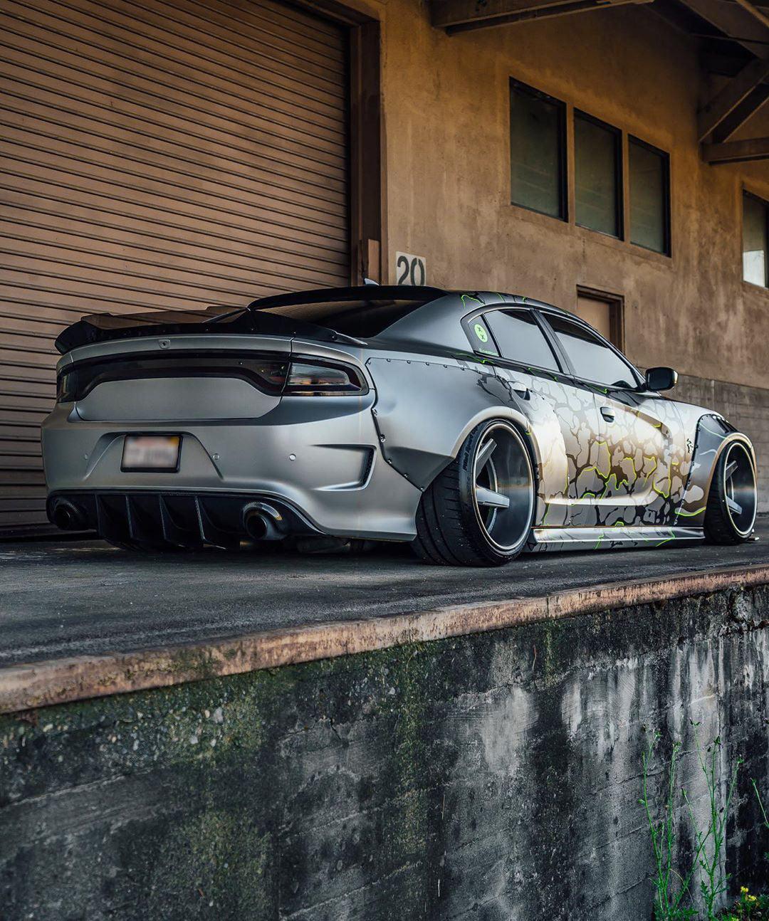Dodge Charger with LD widebody kit SHIROKAI in matte gray parked near industrial building