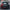 Front view of a black and red Ford Mustang with ford mustang S197 widebody kit SHIROKAI installed on a street