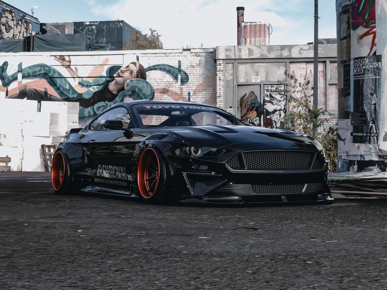Black Ford Mustang S550 with widebody kit SHIROKAI and red rims parked in urban graffiti setting