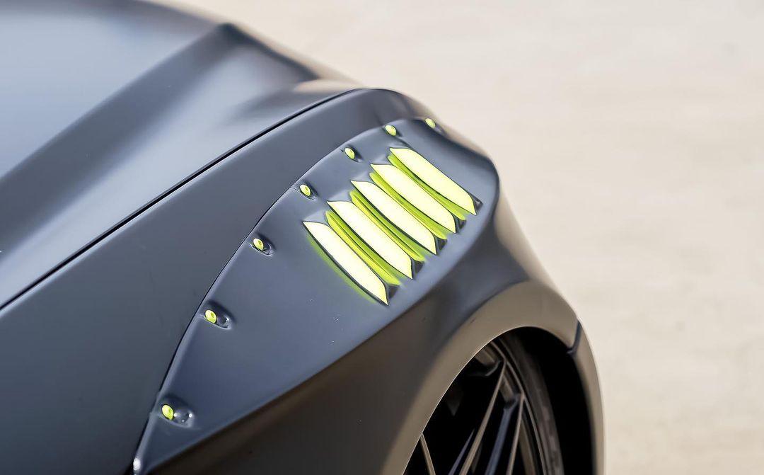 Close-up of Ford Mustang S550 widebody kit SHIROKAI matte black fender with rivet details