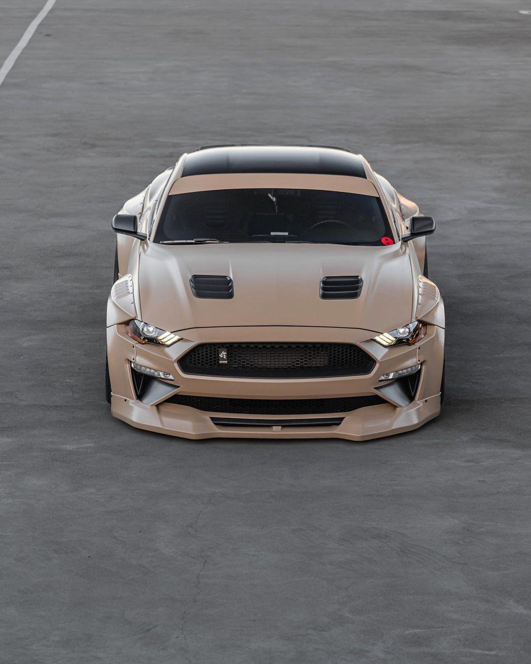 Ford Mustang S550 with SHIROKAI widebody kit featuring aggressive front bumper and aerodynamic vents