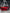 Red Ford Mustang S550 widebody kit SHIROKAI installed on a car in an indoor showroom