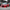 Red Mini Cooper S R53 with SHIROKAI widebody kit parked at a car meet with lowered stance