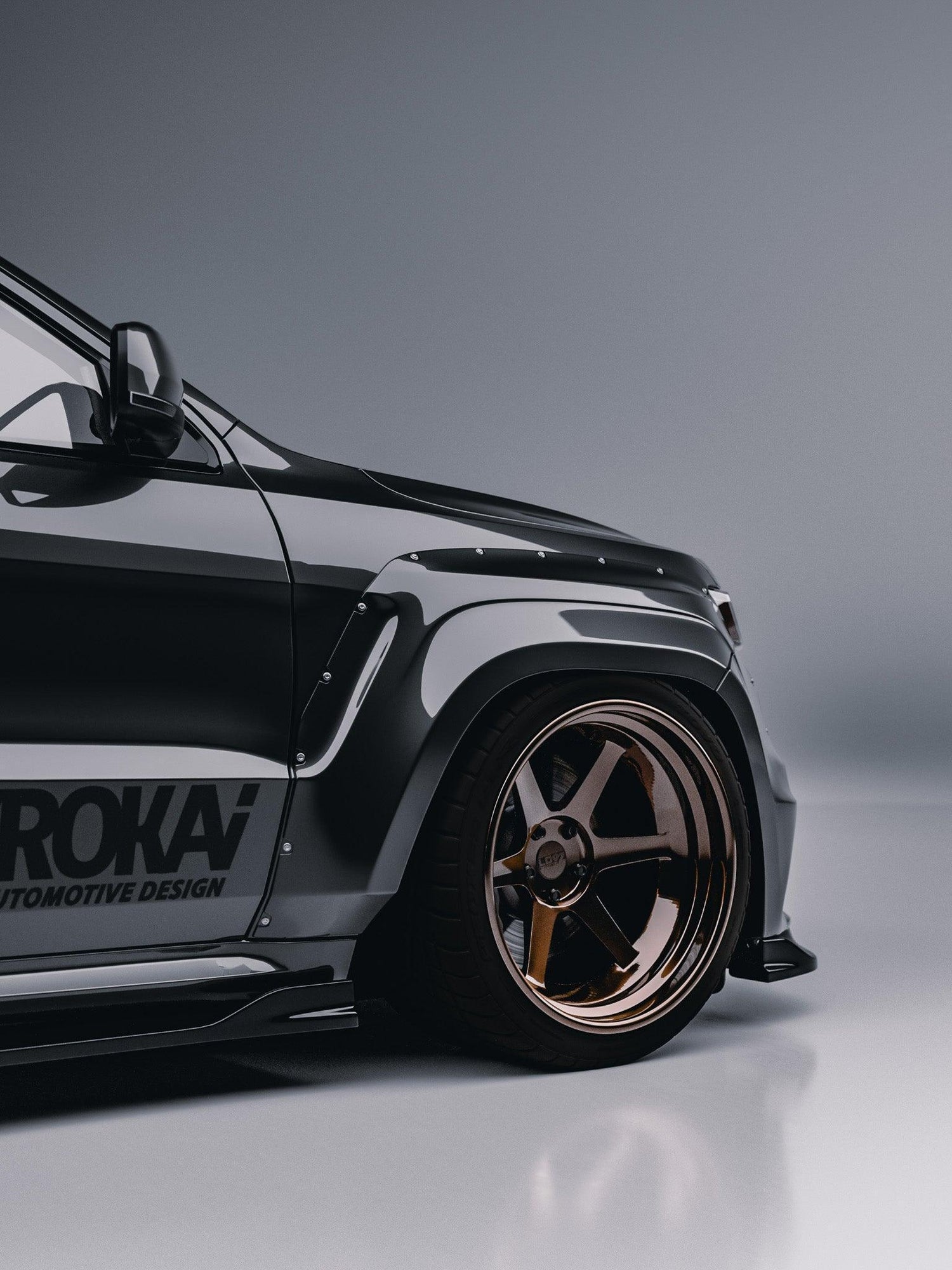 Close-up of black Jeep Grand Cherokee SRT Trackhawk widebody kit SHIROKAI with bronze rims and aggressive fender design