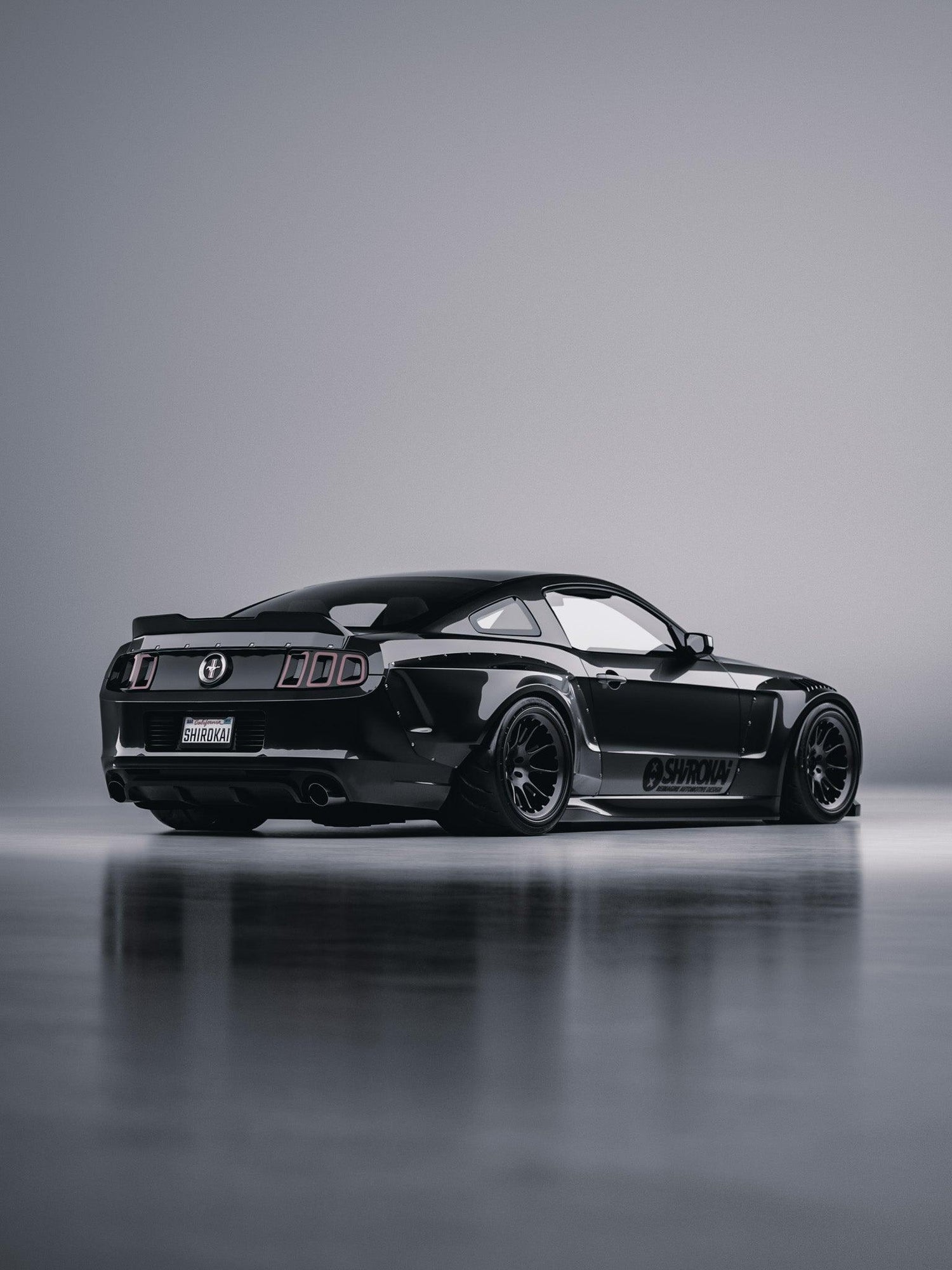 Black 2010-2014 Mustang with SHIROKAI ducktail spoiler trunk upgrade on a sleek sports car