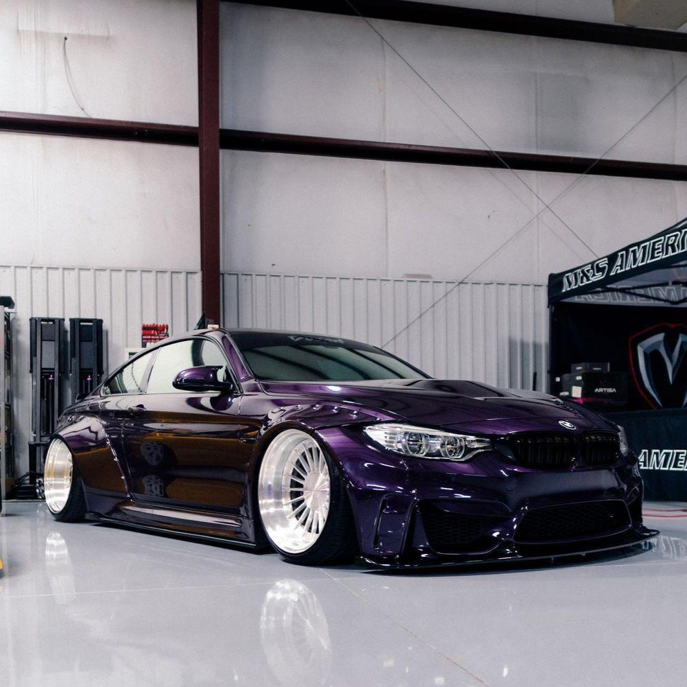Purple BMW M4 F82 2014-2020 with widebody kit for BMW M4 F82 2014-2020 SHIROKAI stance bimmer in a garage